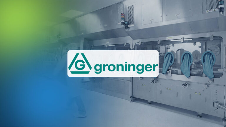 Maschine mit Handschuhen an Bedienöffnungen und dem Schriftzug 'groninger' in einem weißen Rechteck